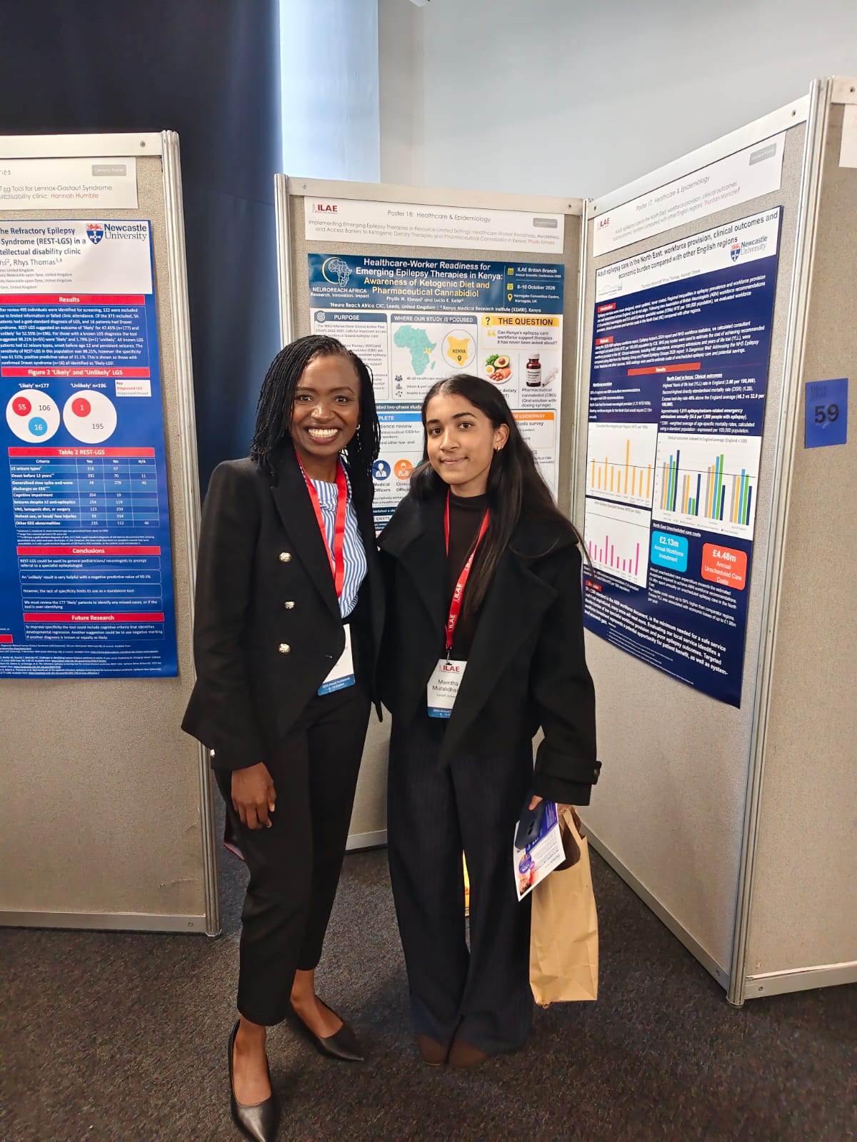 Phyllis with a delegate beside her poster