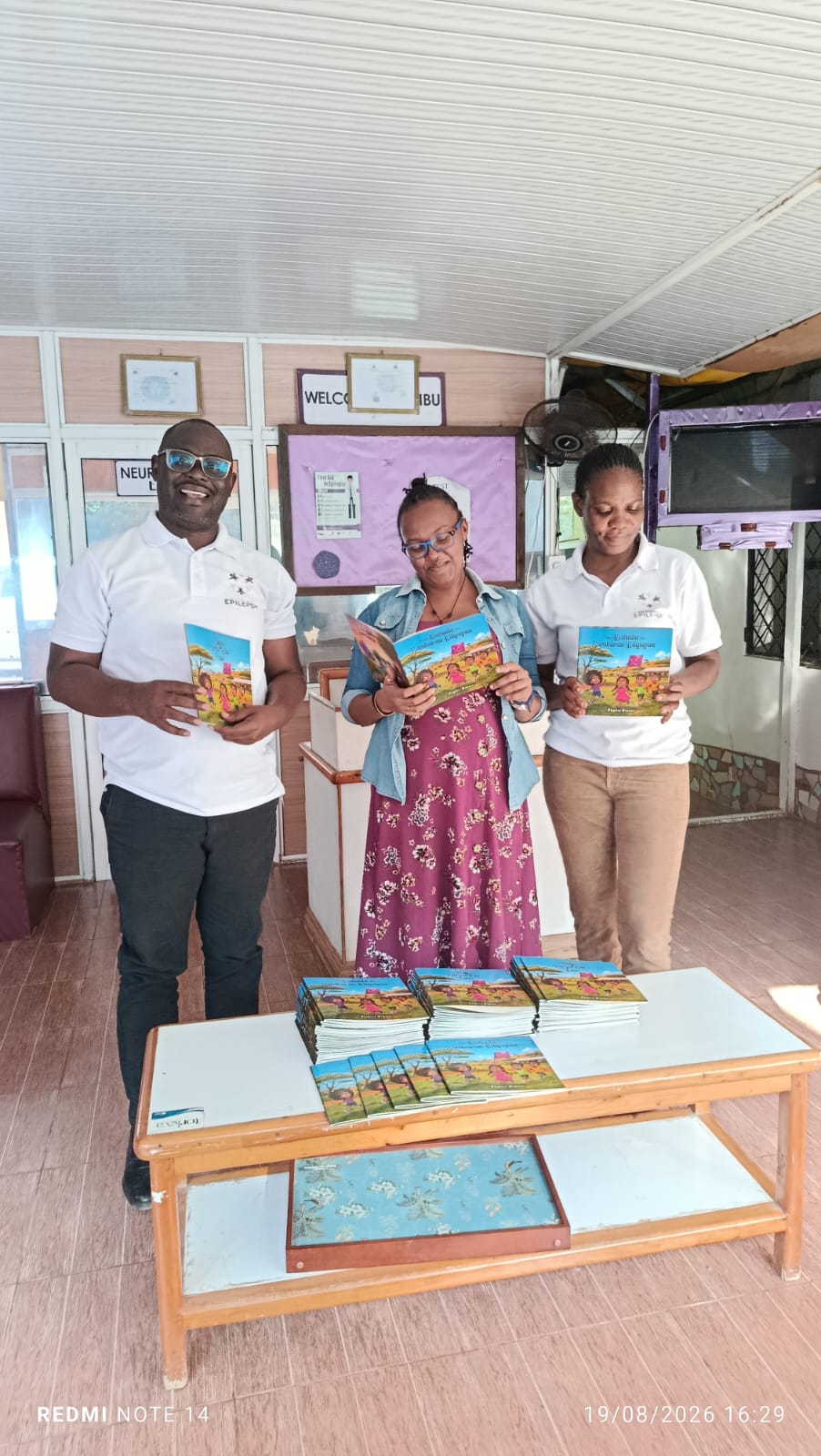 NeuroReach Africa team members with FPE Kenya representatives during a donation of The Day the Purple Kite Flew books.