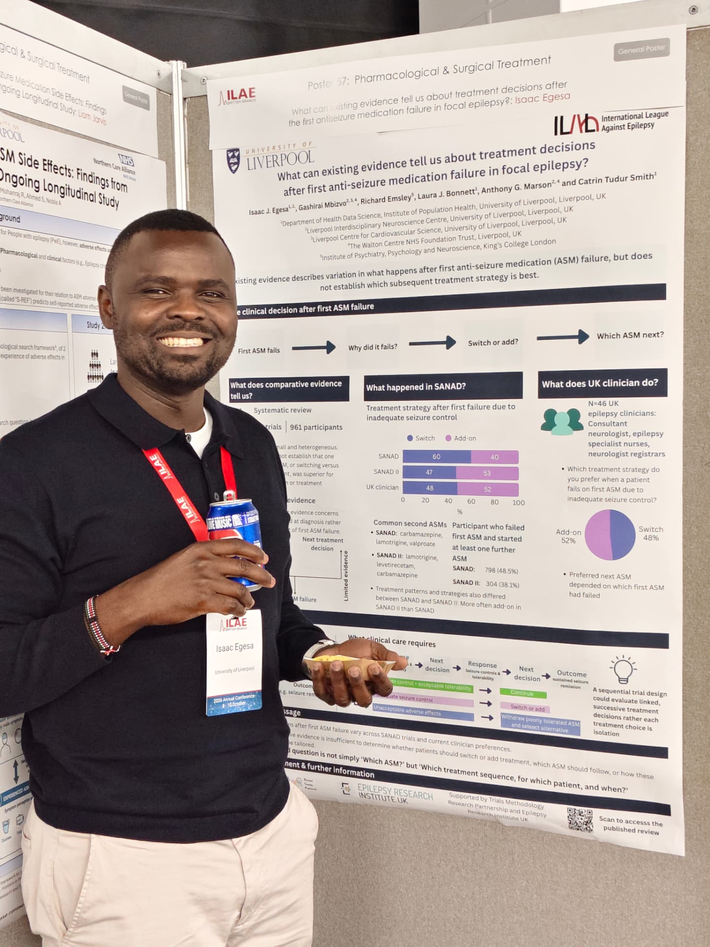 Isaac Egesa beside his University of Liverpool poster