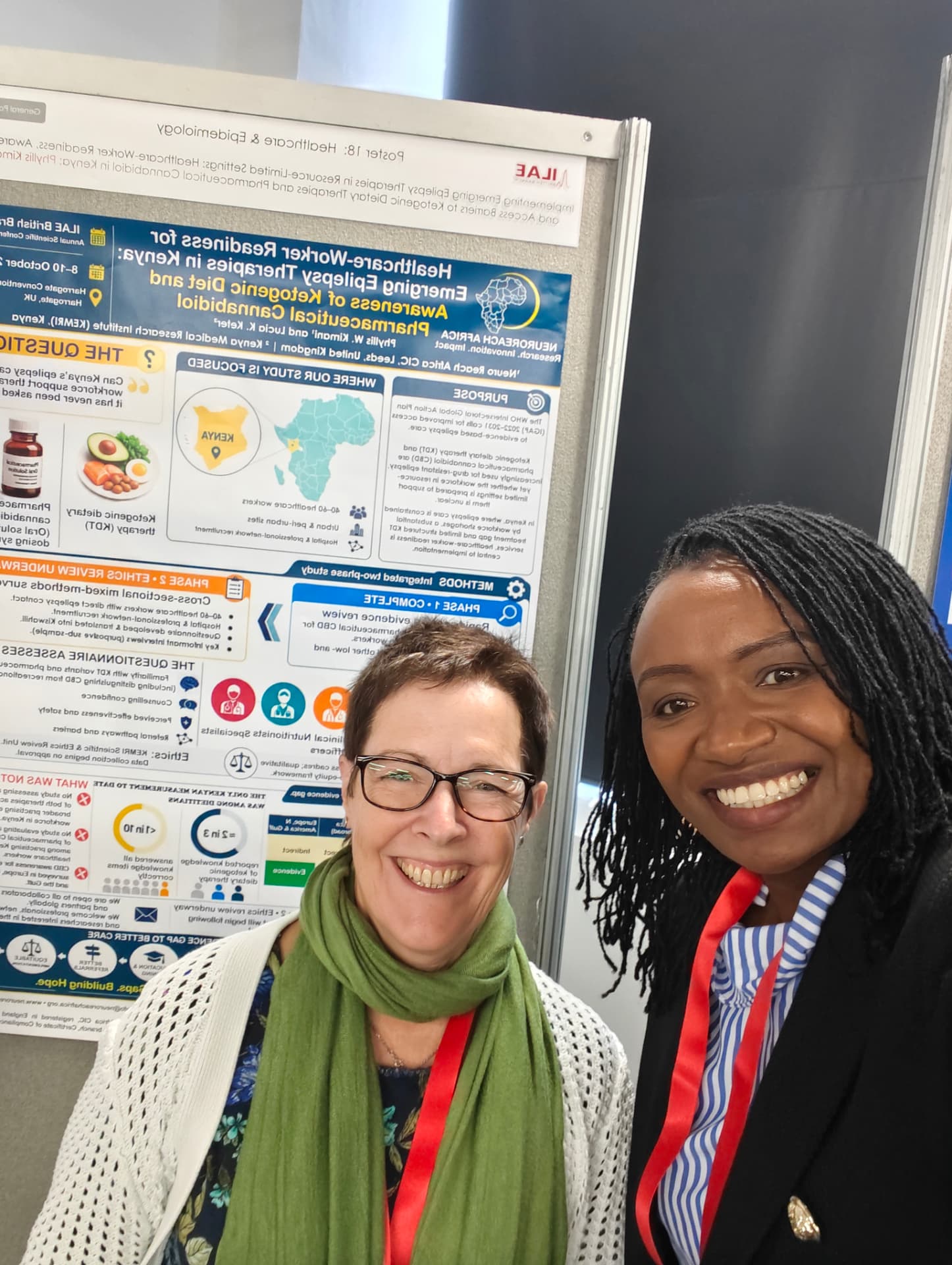 Phyllis with a visitor at her poster