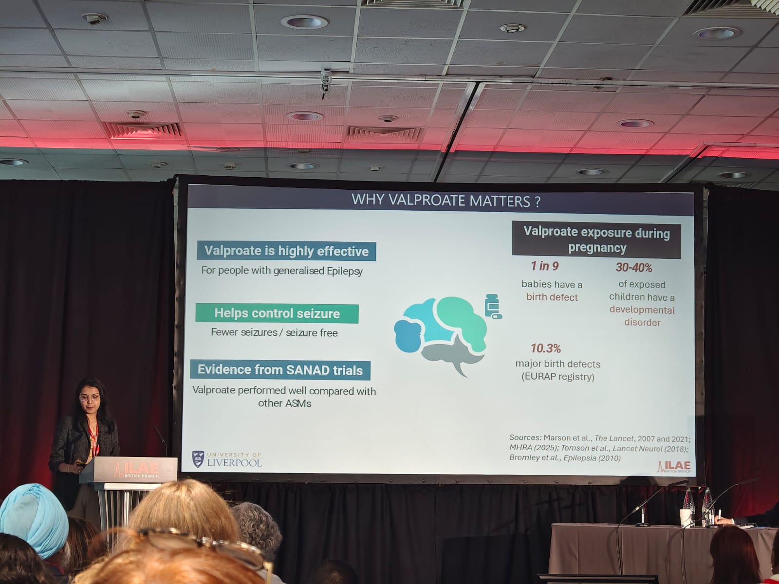 Sneha George presenting on valproate discontinuation