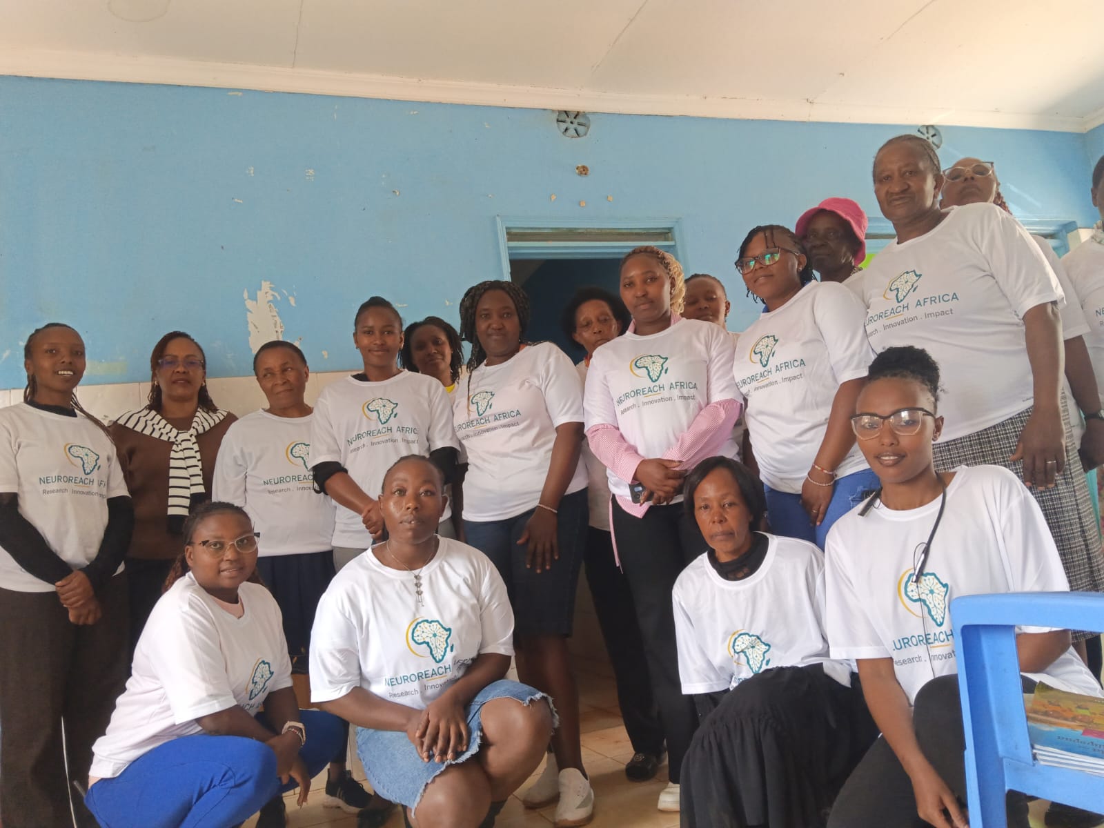 Kabete Epilepsy Champions in NeuroReach Africa T-shirts gathered indoors after their training
